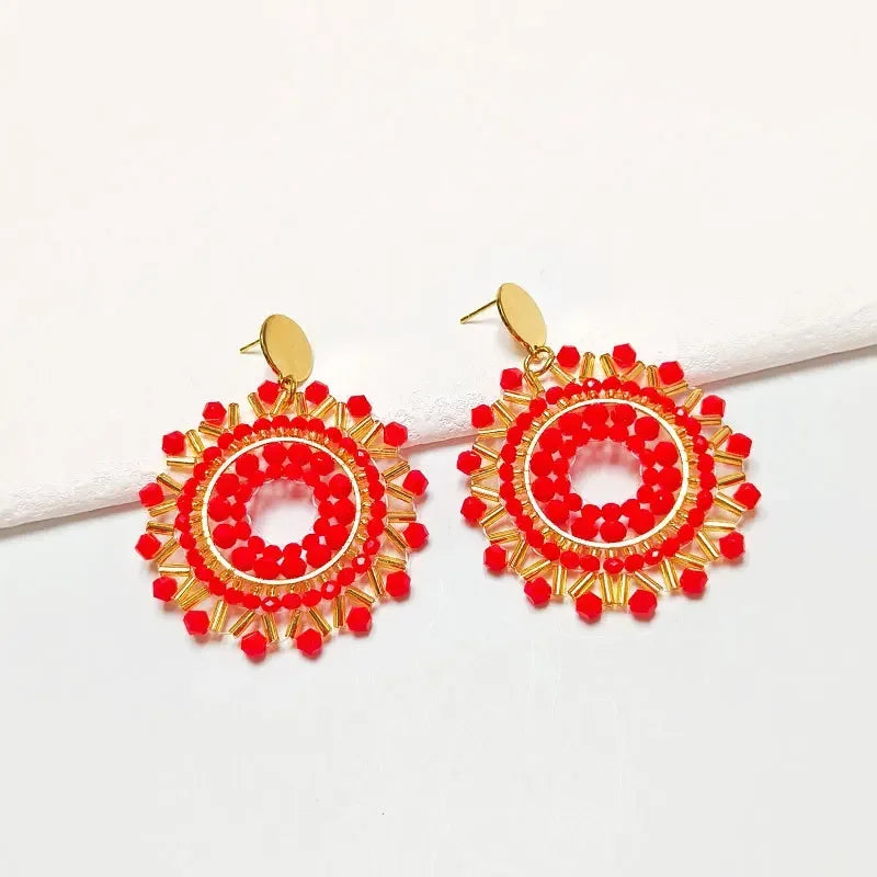 Pendantes soleil en perles rouges