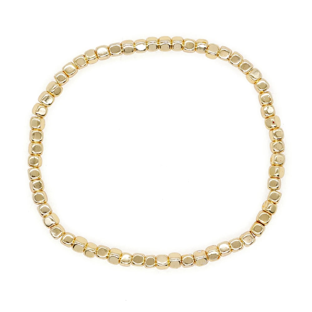 Bracelet billes dorées élastique
