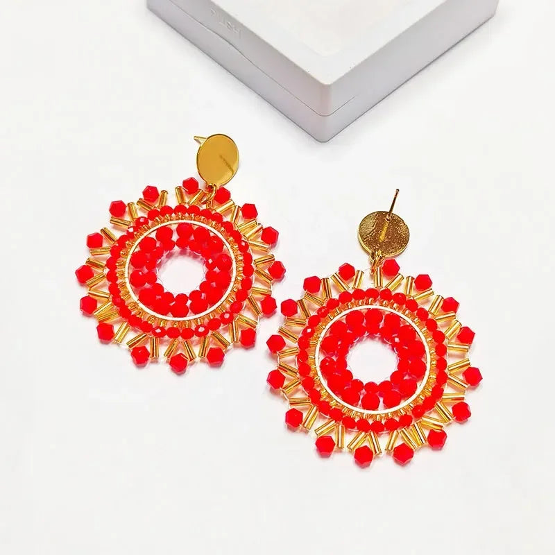 Pendantes soleil en perles rouges