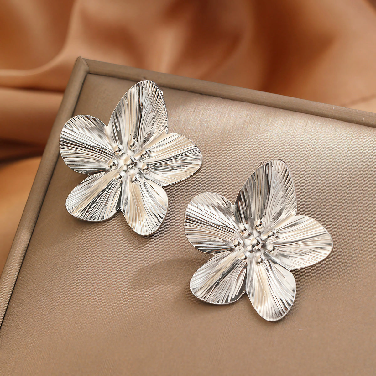 Boucles fleur en métal